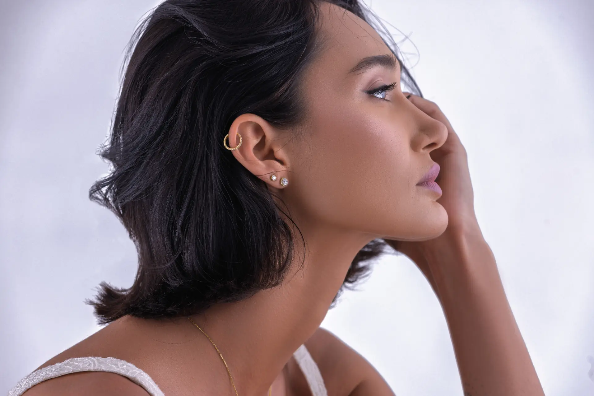 Model wearing Daiman lab-grown diamond ear piercings — helix hoop with stacked studs, Zorae fine jewellery