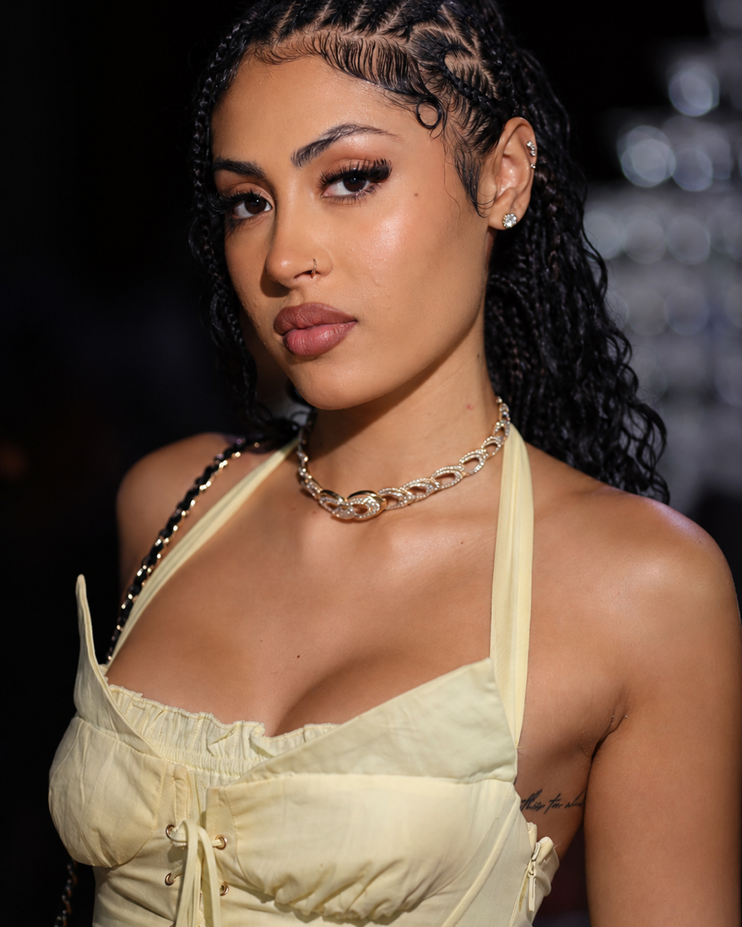Evening portrait wearing a Zorae chain necklace at an event